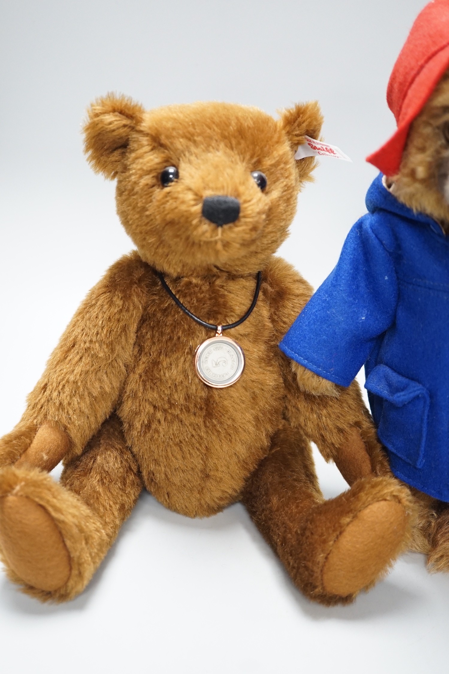 Three boxed Steiff toys: a Paddington bear, a brown bear and a monkey